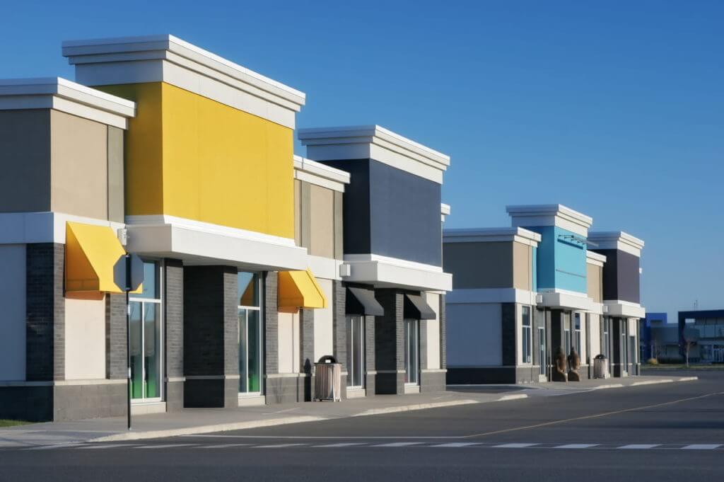 Strip shopping mall featuring several big-box commercial property storefronts